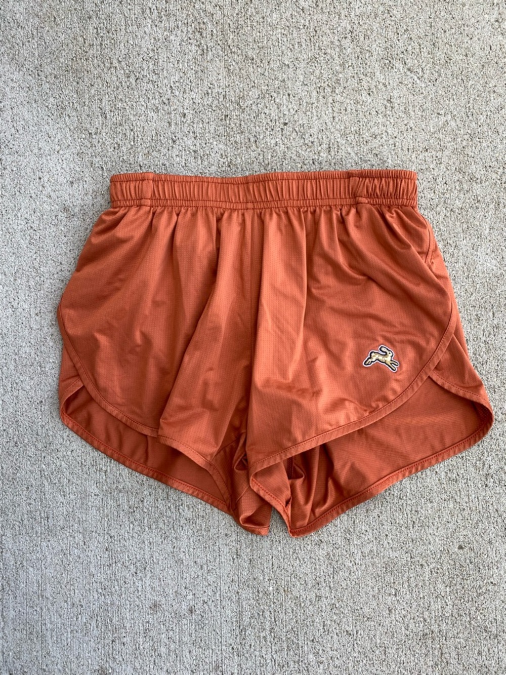 Tracksmith Twilight split shorts rust orange